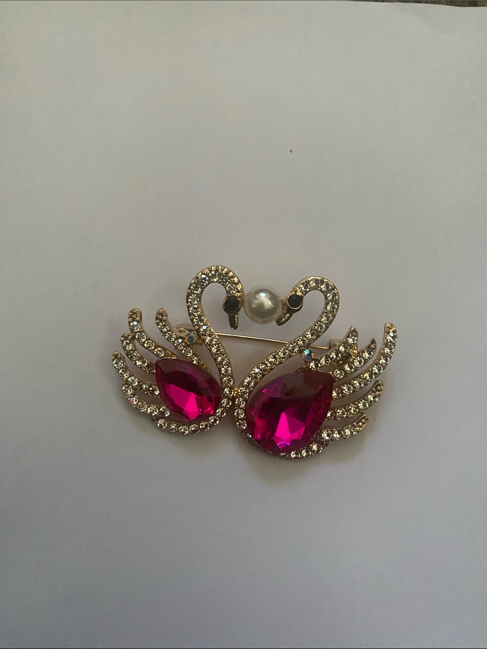 Gold-Tone Swan Brooch with Fuchsia Teardrop Crystals and Pearl Accent